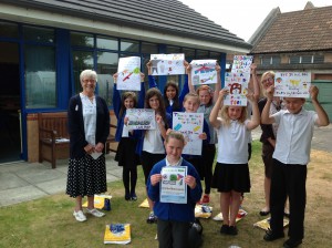 Picture shows the winning entrants with the winner Jessica Clayden at the front.  Her design will now be made into metal signs to appear on lamp posts in the Foxwood area