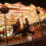 Members of the public ride a carousel adjacent to the 'St Nicholas Fair' Christmas market in the city centre of York, Northern England on December 3, 2014. AFP PHOTO / OLI SCARFF        (Photo credit should read OLI SCARFF/AFP/Getty Images)