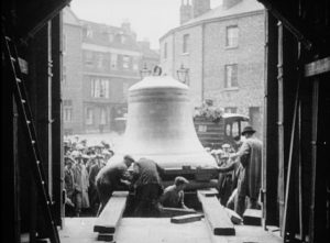 Great Peter of York (1927): On a rainy day a choir sings on the steps of York Minster, witnessing the rare event of the St Peter hour bell, the third largest in the country, being unloaded from the back of an early heavy lorry. The huge bell is manually eased off on sturdy beams of timber, replacing the old one which is by now was nearly a hundred years old.